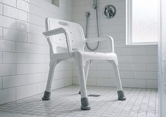Shower chair set up inside a walk-in shower
