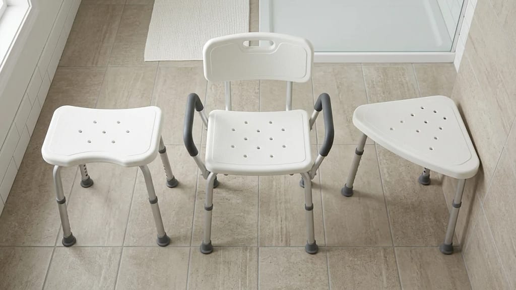 Three types of shower seating compared side by side: a backless stool, a backed chair with armrests, and a corner-fitting triangular seat