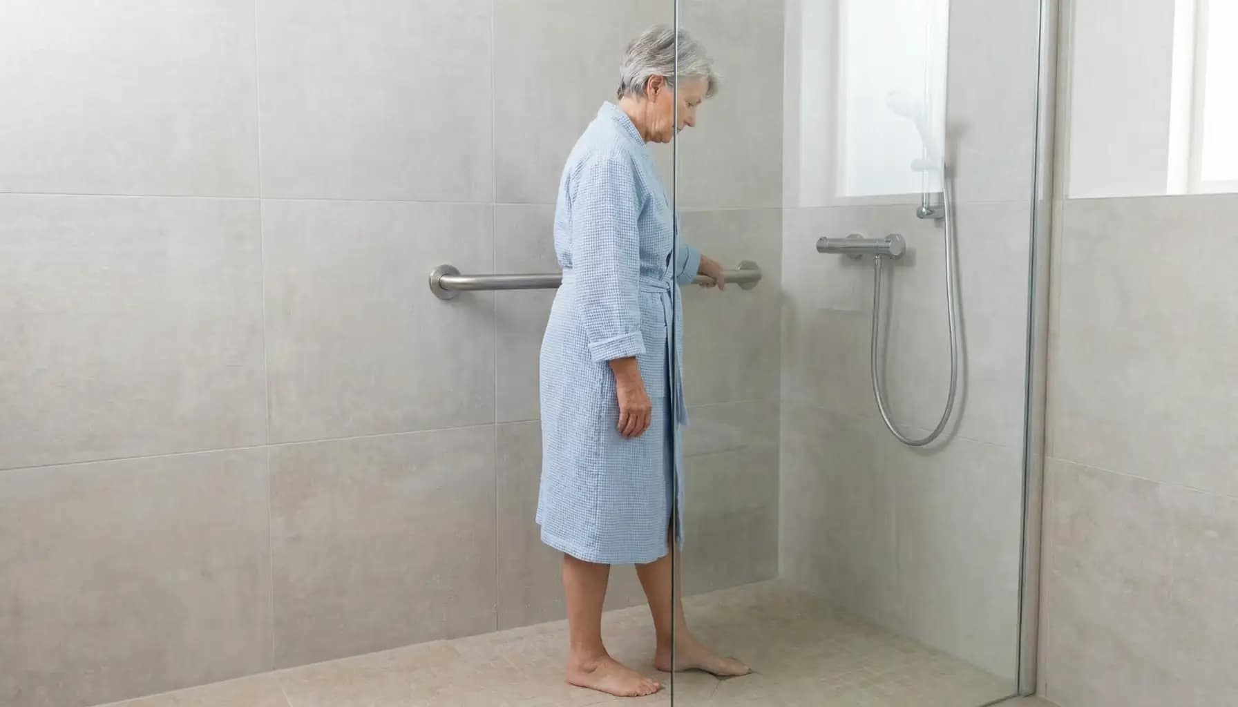 shower grab bars for seniors shown with a senior using a grab bar safely inside a shower
